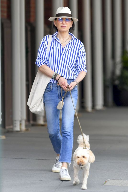 JULIANNA MARGUILES Out with Her Dog in New York 09/24/2023