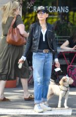 JULIANNA MARGULIES Out with Her Dog in New York 09/21/2023