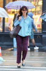 KATIE HOLMES Out on a Rainy Day in New York 09/18/2023