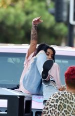 KATIE PRICE Climbs onto a Vivid Pink Car Outside Neighbourhood Restaurant in Liverpool 09/04/2023