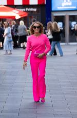 AMANDA HOLDEN in a Neon Pink Jumper and Trousers Leaves Heart FM in London 10/10/2023