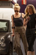 AMBER HEARD Hobbling on Crutches Out in Madrid 10/13/2023