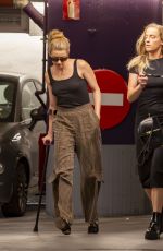 AMBER HEARD Hobbling on Crutches Out in Madrid 10/13/2023