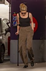 AMBER HEARD Hobbling on Crutches Out in Madrid 10/13/2023