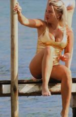 EVELYN BURDECKI in a Golden Swimsuit at a Beach in Ibiza, October 2023