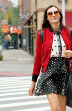 FAMKE JANSSEN in a Starry Mini Skirt, Red Varsity Jacket, White Socks and Mary Jane Flats Out in New York 10/30/2023
