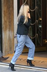 KATE MOSS in a Short Black Blazer, Shear Top, Jeans and Boots Out in London 09/29/2023