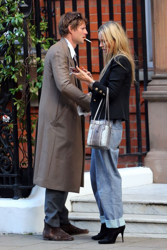 KATE MOSS in a Short Black Blazer, Shear Top, Jeans and Boots Out in London 09/29/2023