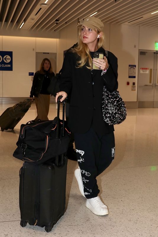 KATHRYN NEWTON Arrives at LAX Airport in Los Angeles 10/15/2023
