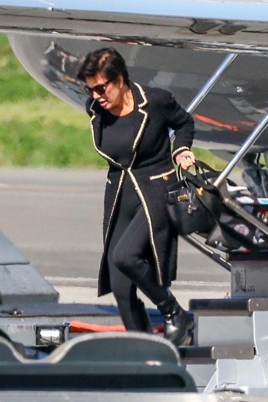 KRIS JENNER and Corey Gamble Arrives at Van Nuys Airport 10/03/2023