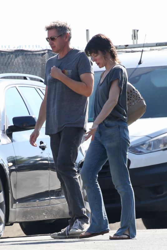 MILLA JOVOVICH and Paul W.S. Anderson Inspecting a Under-construction Home in Brentwood 10/10/2023