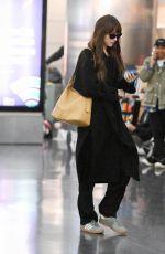 DAKOTA JOHNSON Arrives at JFK Airport in New York 11/09/2023
