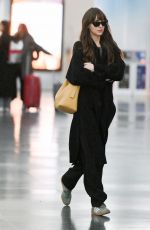 DAKOTA JOHNSON Arrives at JFK Airport in New York 11/09/2023