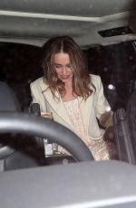 EMILIA CLARKE Leaves Harper