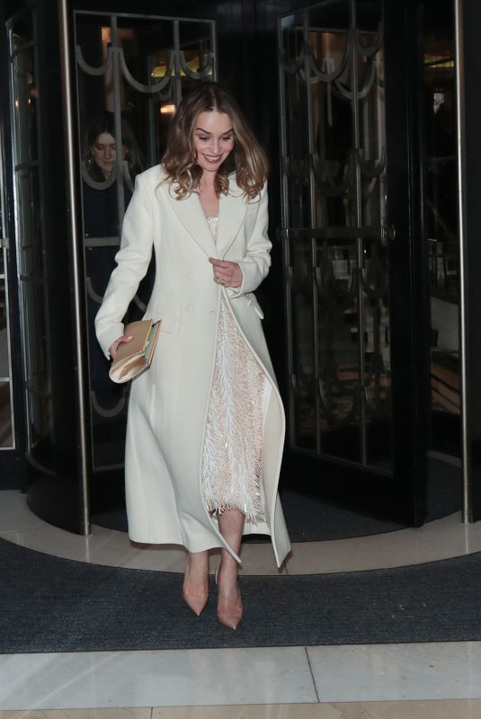 EMILIA CLARKE Leaves Harper