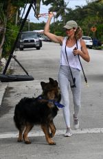 GISELE BUNDCHEN Out with Her German Shepherd in Surfside 11/02/2023