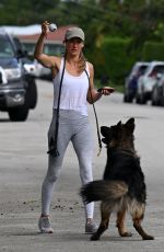 GISELE BUNDCHEN Out with Her German Shepherd in Surfside 11/02/2023