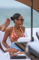 JOAN SMALLS in Bikini at a Beach in Miami 11/28/2023