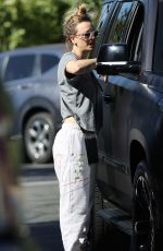 KALEY CUOCO Paused for a Friendly Chat in a Parking Lot in Malibu 11/23/2023