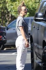 KALEY CUOCO Paused for a Friendly Chat in a Parking Lot in Malibu 11/23/2023