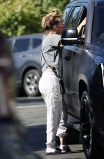 KALEY CUOCO Paused for a Friendly Chat in a Parking Lot in Malibu 11/23/2023