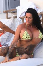KATIE PRICE and Girlfriend in Bikinis at a Pool in Mykonos 11/27/2023