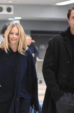 MARGOT ROBBIE and Tom Ackerley at JFK Airport in New York 11/26/2023