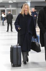 MARGOT ROBBIE and Tom Ackerley at JFK Airport in New York 11/26/2023