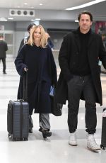 MARGOT ROBBIE and Tom Ackerley at JFK Airport in New York 11/26/2023