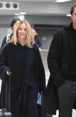 MARGOT ROBBIE and Tom Ackerley at JFK Airport in New York 11/26/2023