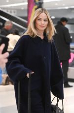 MARGOT ROBBIE Arrives at Airport in New York 11/26/2023