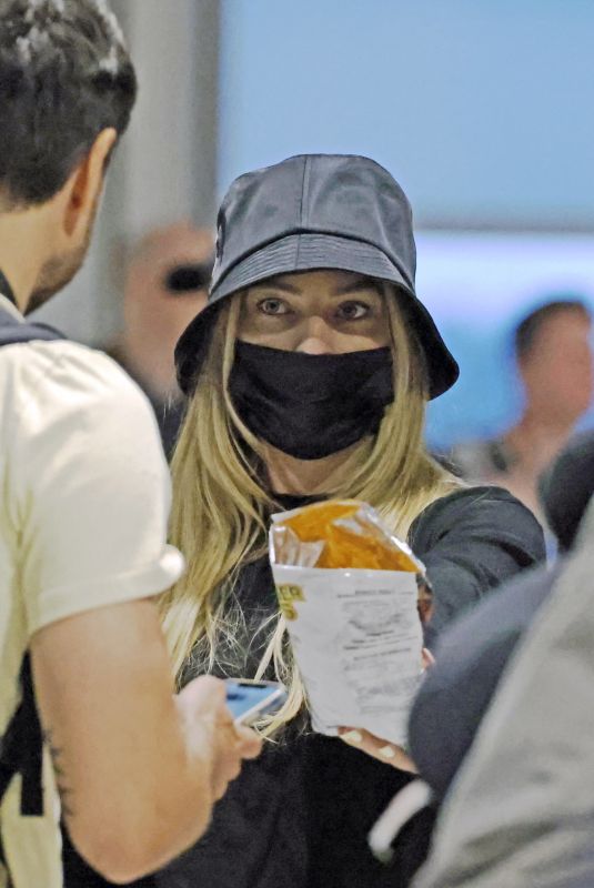 MARGOT ROBBIE at Airport in Melbourne 11/07/2023