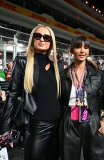 NINA DOBREV and PARIS HILTON at F1 Grand Prix of Las Vegas 11/18/2023