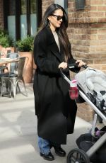 OLIVIA MUNN Out with Her Uppababy Stroller in New York 11/04/2023