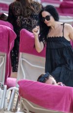 ANDREA CORR Relaxing on the Beach at Sandy Lane Hotel in Barbados 12/28/2023