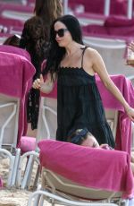 ANDREA CORR Relaxing on the Beach at Sandy Lane Hotel in Barbados 12/28/2023