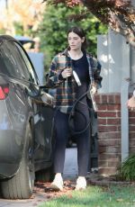 ASHLEY GREENE Arrives at a Friend
