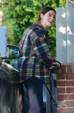 ASHLEY GREENE Arrives at a Friend