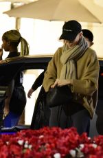 CHARLIZE THERON Shopping at Grove Mall with Jackson in Los Angeles 12/18/2023