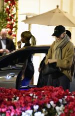 CHARLIZE THERON Shopping at Grove Mall with Jackson in Los Angeles 12/18/2023
