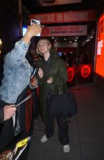 ELLE FANNING Signing Autographs Outside Hayes Theatre at Broadway in Manhattan 12/26/2023