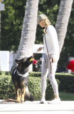 GISELE BUNDCHEN Out with Her Dog in Miami Beach 12/19/2023