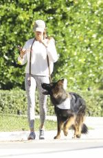 GISELE BUNDCHEN Out with Her Dog in Miami Beach 12/19/2023
