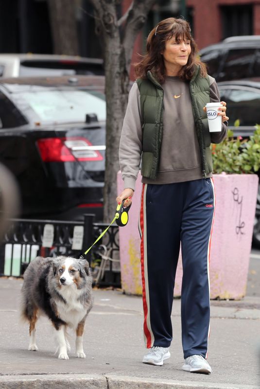 HELENA CHRISTENSEN Out for Morning Coffee with Her Dog in New York 12/17/2023