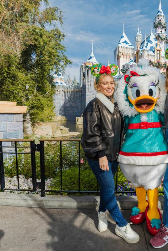 HILARY DUFF and MANDY MOORE at Disneyland Park 12/11/2023