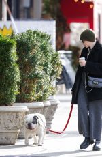 JULIA GARNER Out with Her Dog in New York 12/19/2023