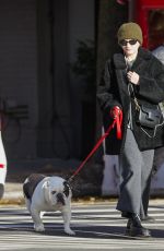 JULIA GARNER Out with Her Dog in New York 12/19/2023