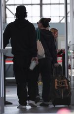KALEY CUOCO and Tom Pelphrey Arrives at Burbank Airport 12/16/2023