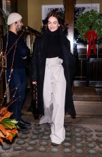 LILY JAMES Leaves Her Hotel in New York 12/17/2023