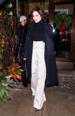 LILY JAMES Leaves Her Hotel in New York 12/17/2023